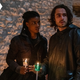 Ashley Romans's Agent 355 and Ben Schnetzer's Yorick are both wearing dark clothes and holding lit candles in a vigil setting on Y The Last Man.